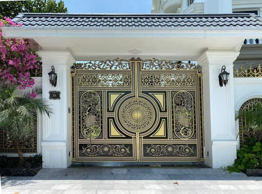 Mẫu cửa cổng nhôm đúc 2 cánh trống đồng